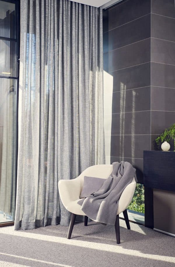 sheer light grey curtains in living room